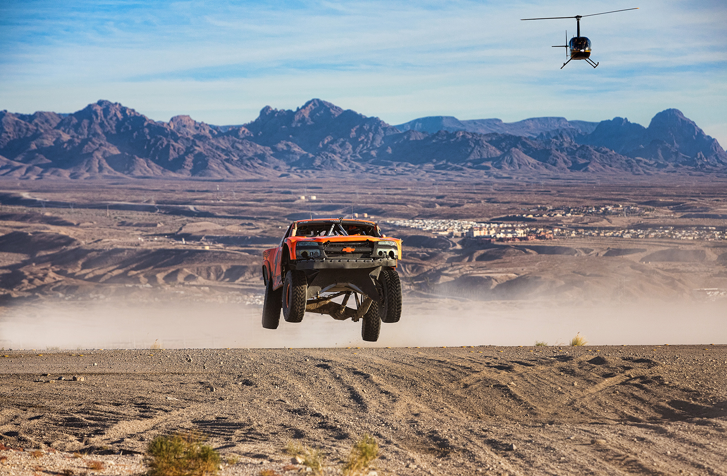 off road trucks racing on pavement