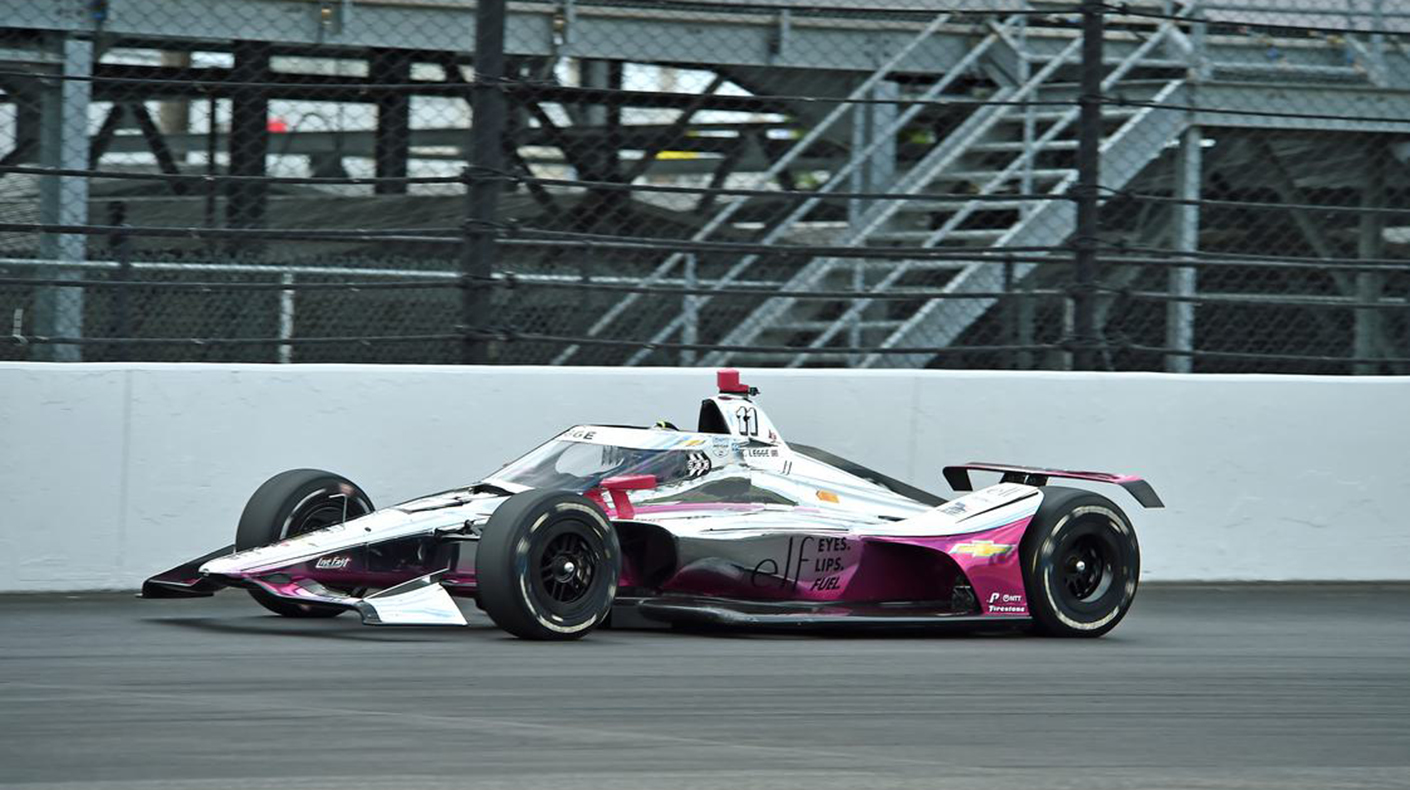 Katherine Legge driving an Indycar at IMS.