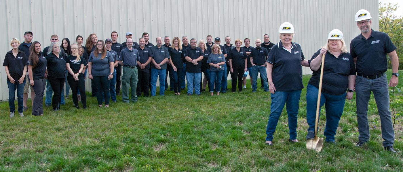 Design Engineering Inc. team in front of its Avon, Lake headquarters
