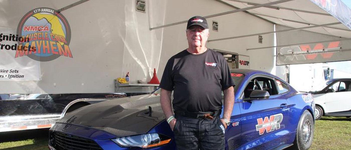 Chuck Watson Sr. in front of the Watson Racing 2016 Mustang Cobra Jet at NMCA competition