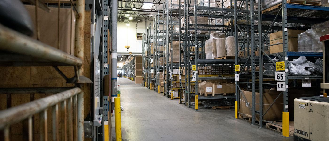 Image of EMPI's Anaheim, California warehouse with rows of shelves and boxes