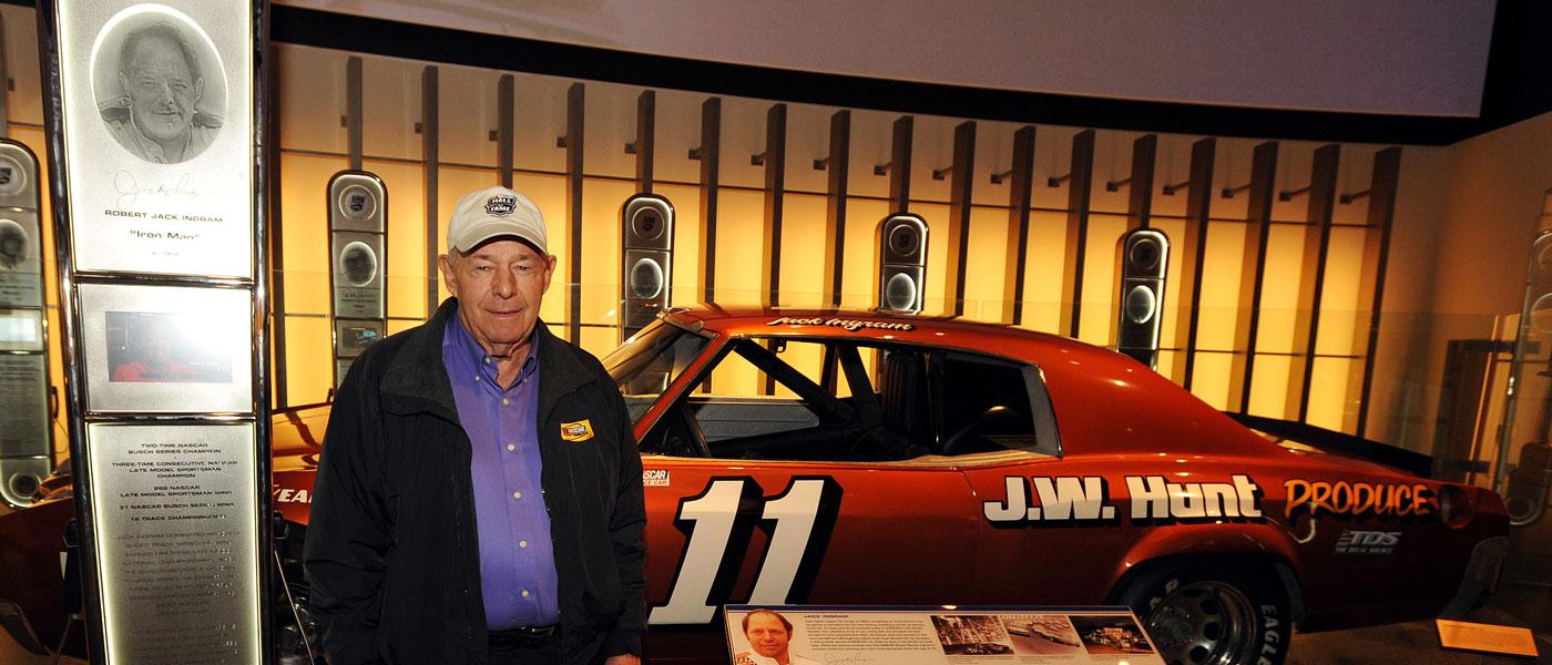 Jack Ingram standing in front of the No. 11 race car in a museum. Photo by Rainier Ehrhardt/NASCAR via Getty Images