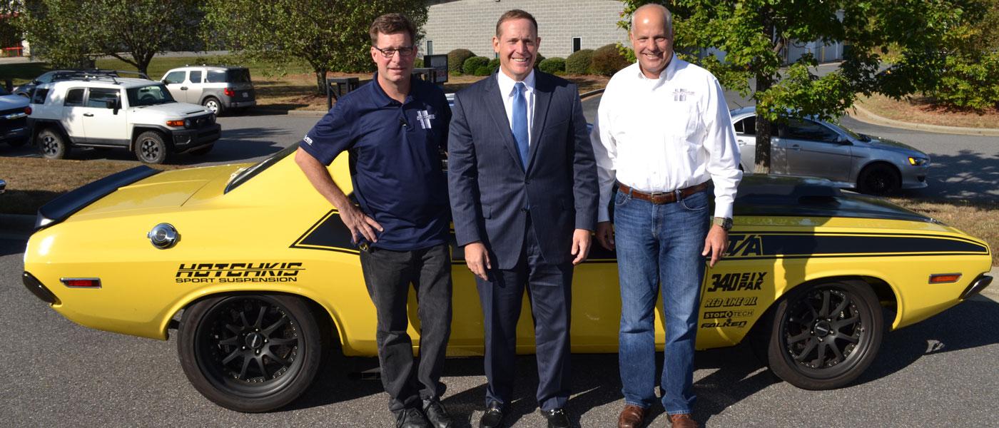 Ron Thiel, left, and John Hotchkis, right, of Hotchkis Performance, met with Rep. Ted Budd, center, in Washington, DC