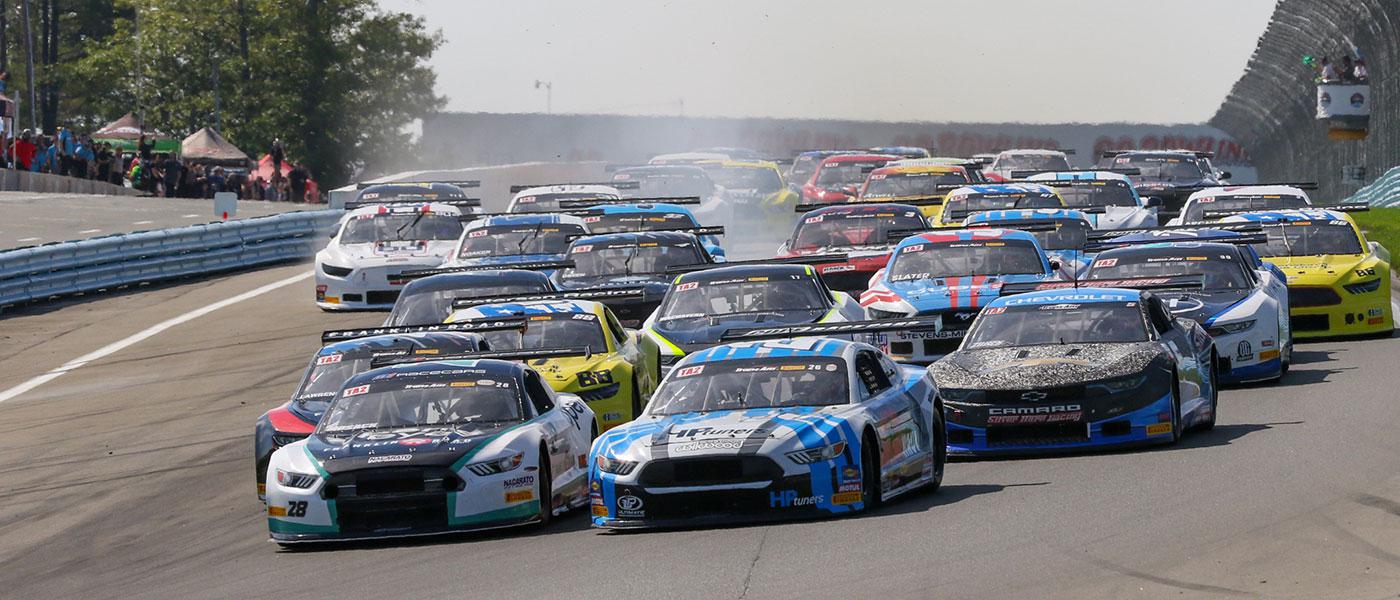 The Trans Am Series field drives into Turn 1