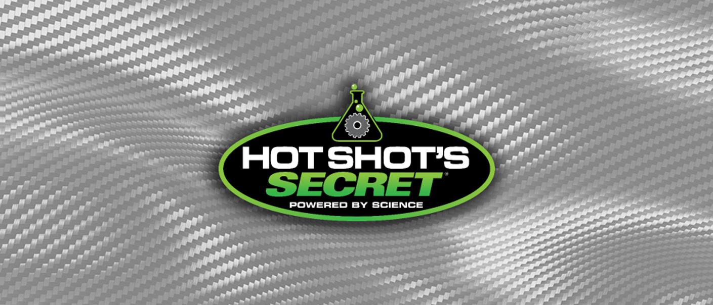 The Hot Shot's Secret logo overtop a carbon fiber background.