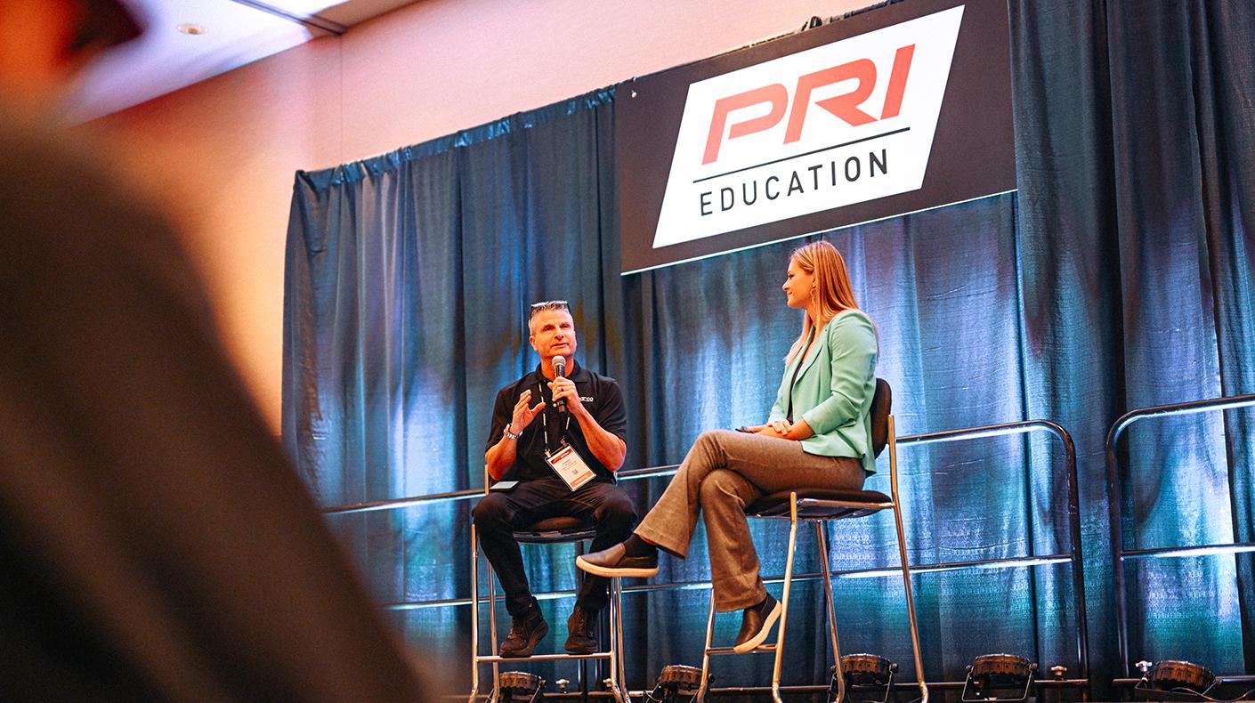 A PRI Education speaker on stage.