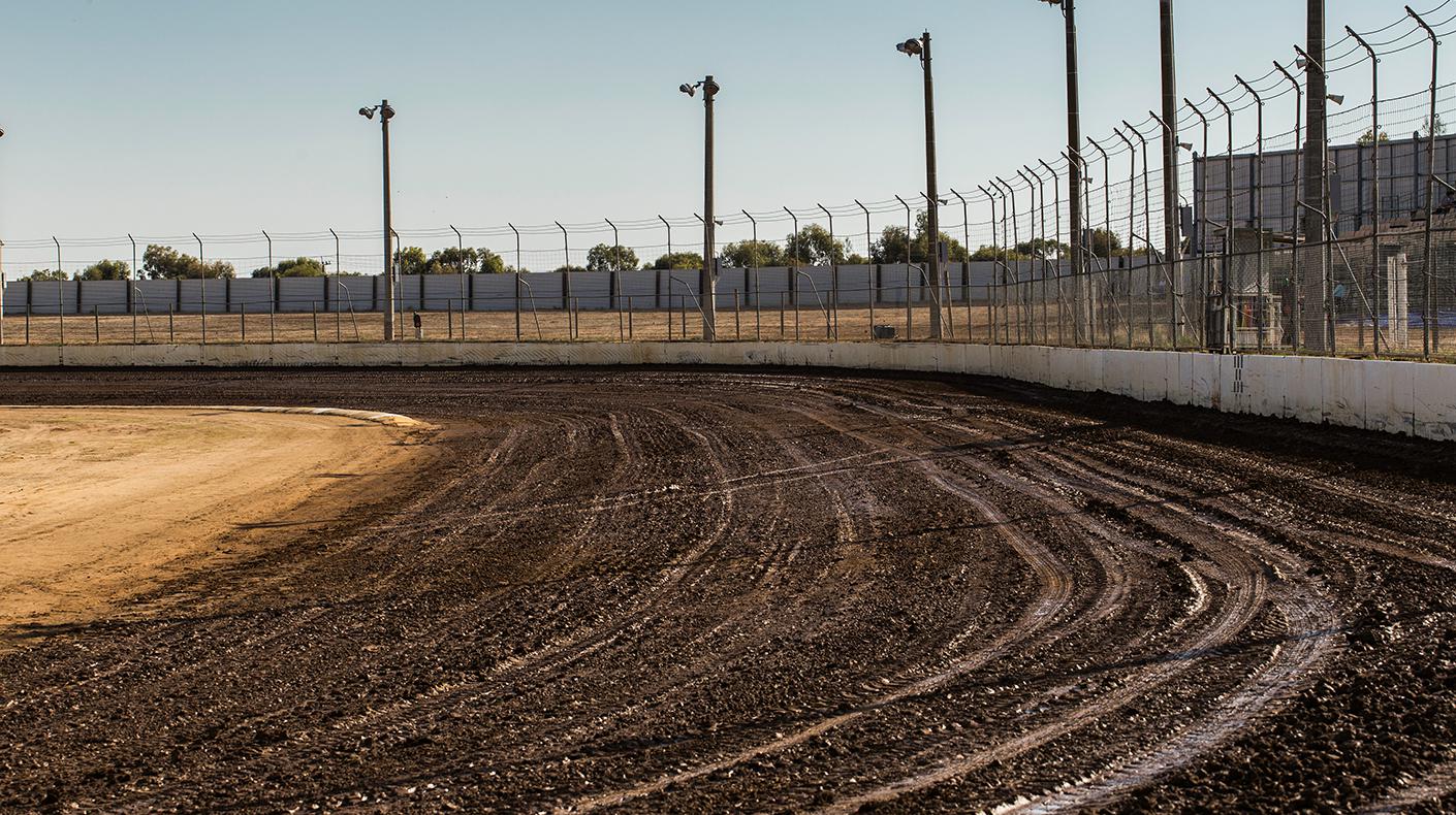 A dirt oval race track.
