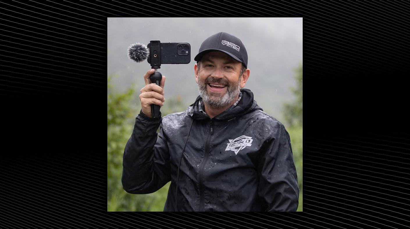 An image of a smiling Kyle Loftis in 1320Video gear.