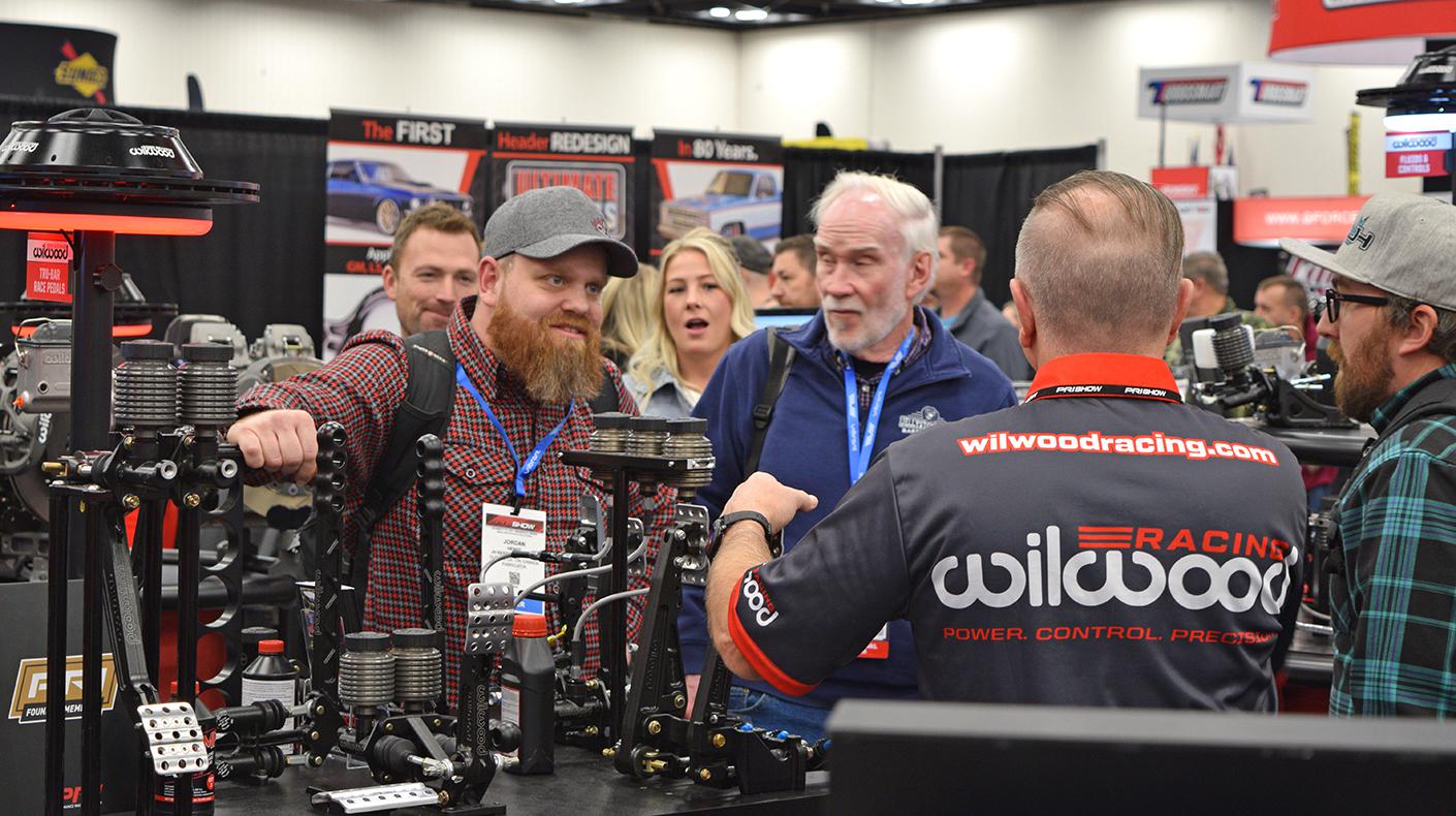 Attendees talking with exhibitors at the PRI Show.