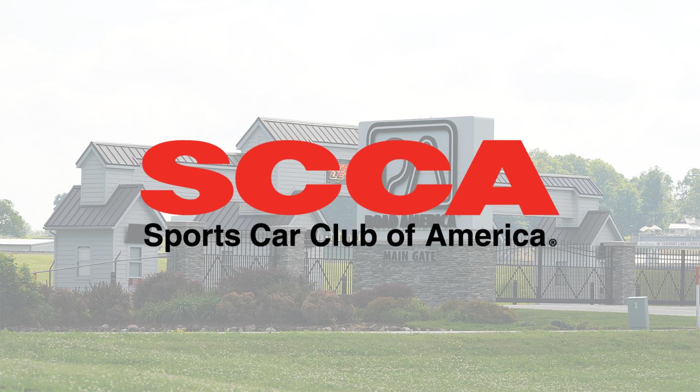 The SCCA logo over a photo of the main gate at Road America.