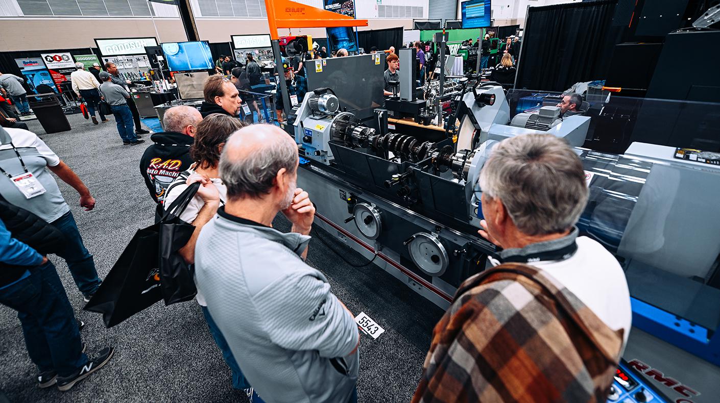 People gathered around a booth at the PRI show.