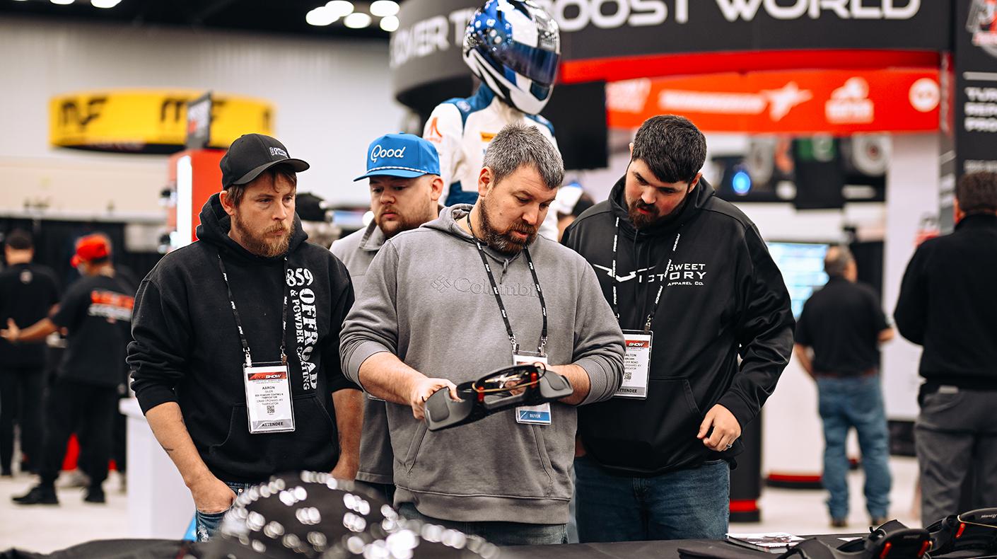 Attendees in a booth at the PRI Show.