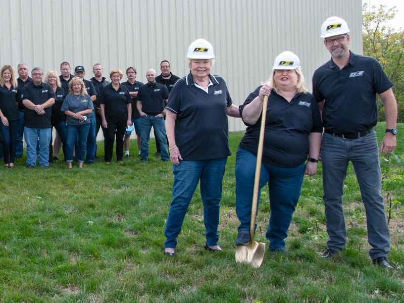 Design Engineering Inc. team in front of its Avon, Lake headquarters