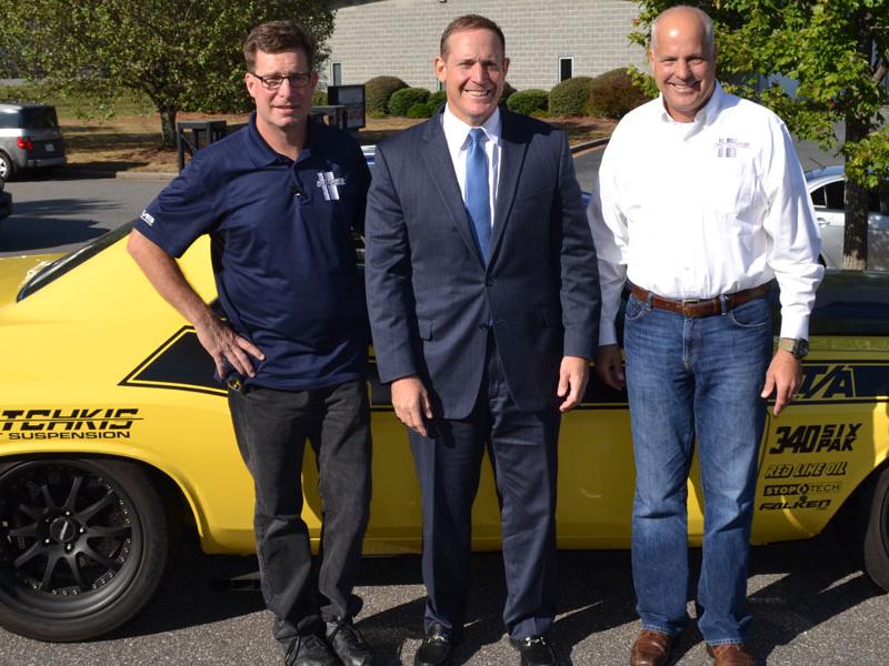 Ron Thiel, left, and John Hotchkis, right, of Hotchkis Performance, met with Rep. Ted Budd, center, in Washington, DC