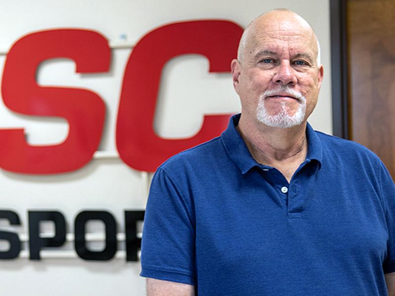 Robert Sager standing in front of PSC Motorsports signage