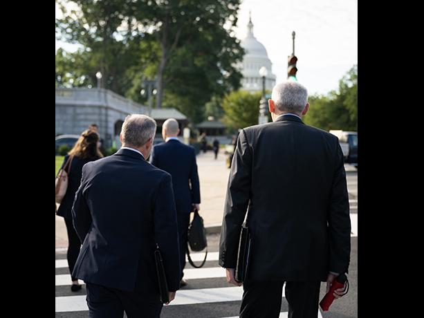 PRI President Dr. Jamie Meyer and SEMA Chairman of the Board James Lawrence walking toward the US Capitol