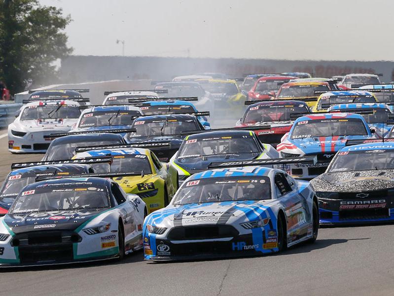 The Trans Am Series field drives into Turn 1