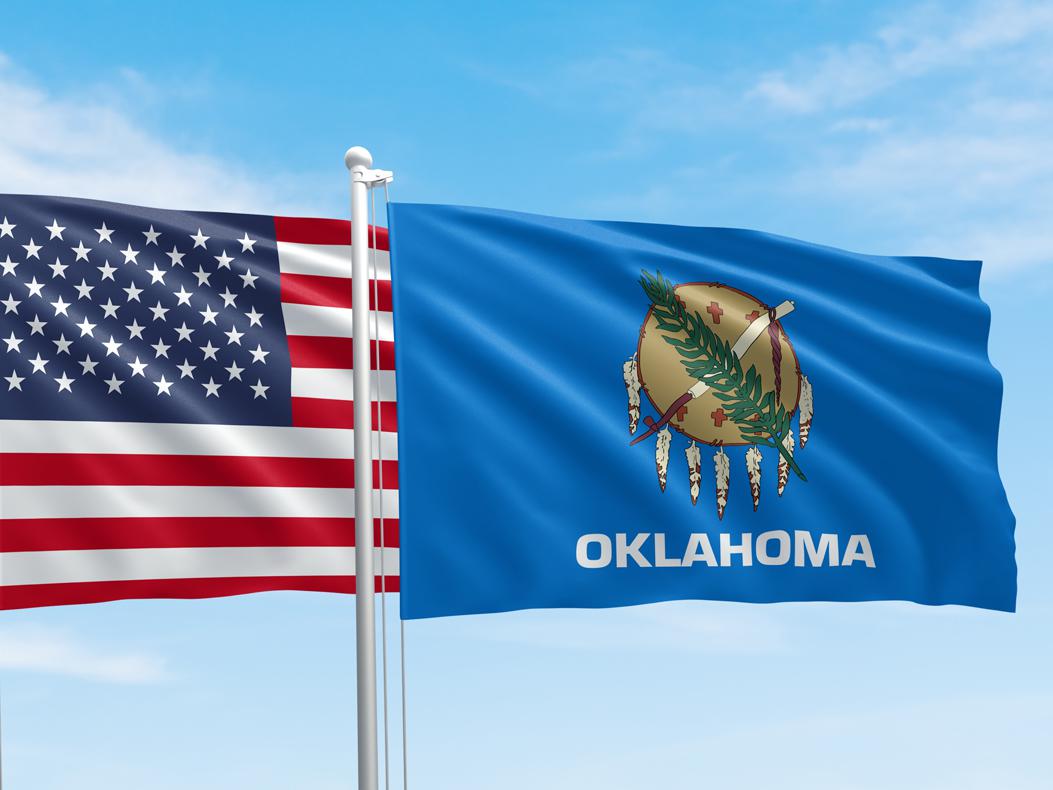 Image of US flag and Oklahoma state flag. courtesy of Shutterstock, zmotions.