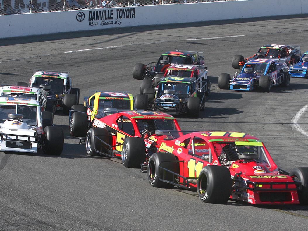A photo of modified cars racing at South Boston Speedway in Virginia. Photo courtesy of NASCAR.