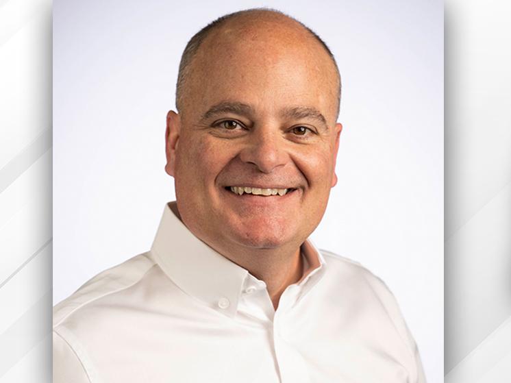 Photo of new INDYCAR VP of Competition, Race Engineering Mike O'Gara and the INDYCAR logo.