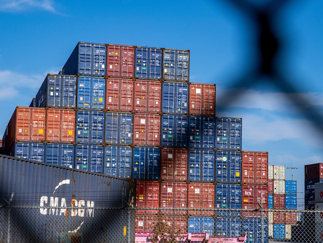 Shipping containers stacked at a port.