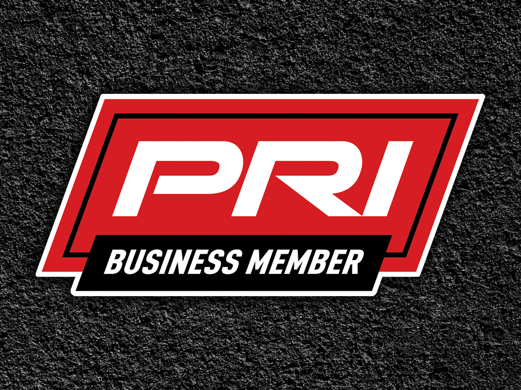 An image of the PRI Business Member logo overlaid asphalt background.