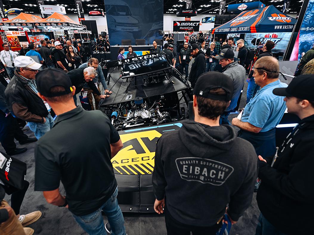 PRI attendees in a booth.