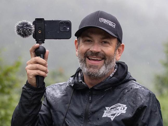 An image of a smiling Kyle Loftis in 1320Video gear.