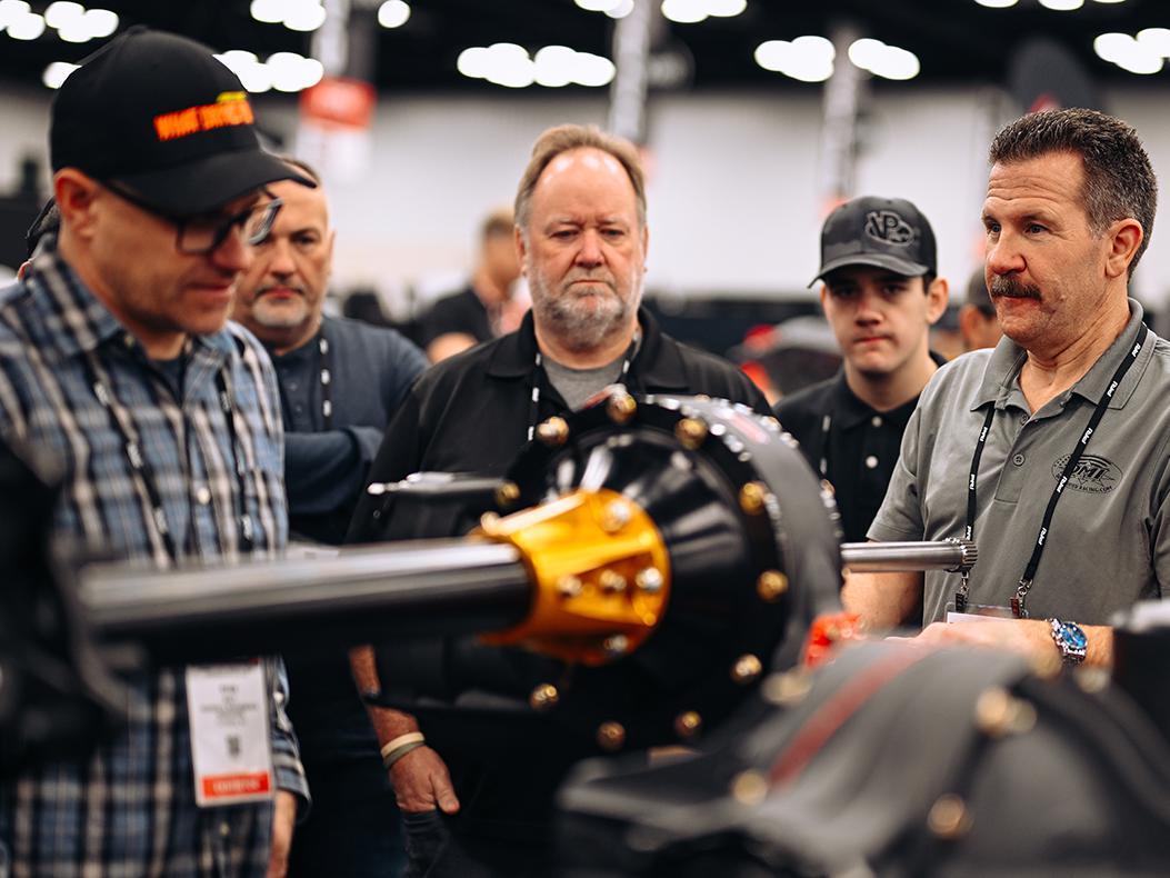 Attendees in a booth at the PRI Show.