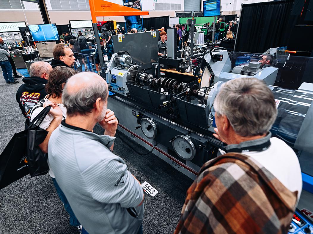 People gathered around a booth at the PRI show.