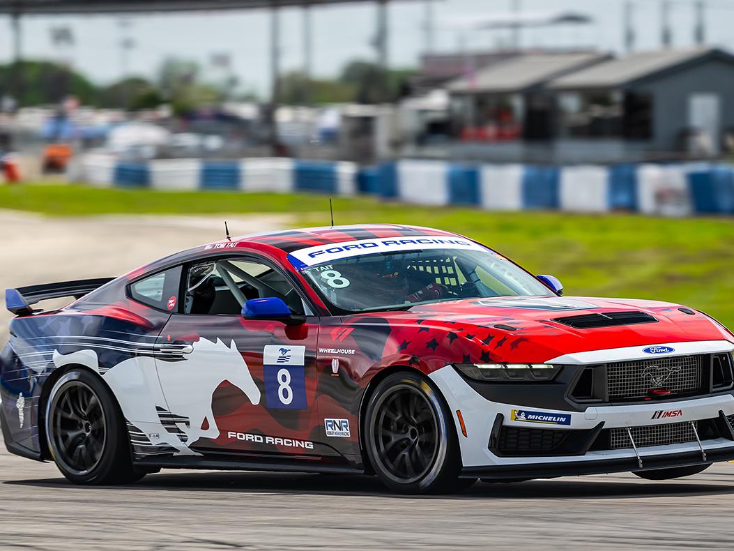 Ford Mustang Challenge car on track.